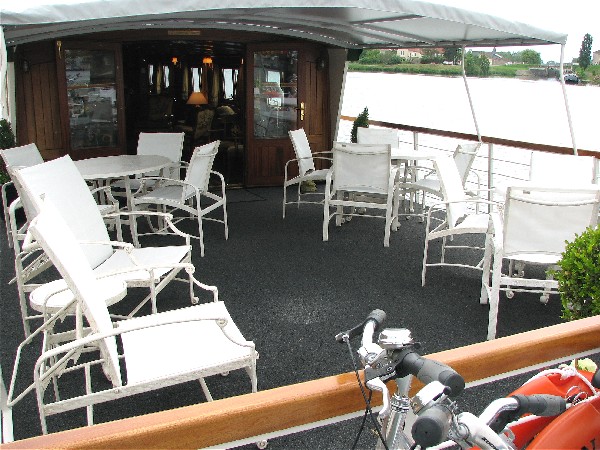 The canopied sundeck aboard the Nenuphar is perfect for alfresco meals or enjoying the scenery