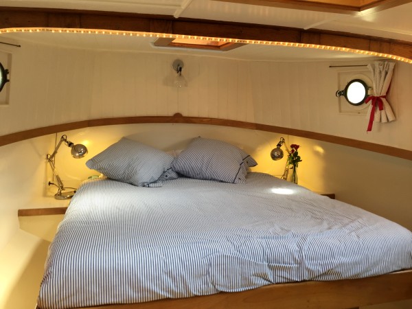 Soft lighting frames the fixed queen bed in
the aft cabin providing a warm ambiance